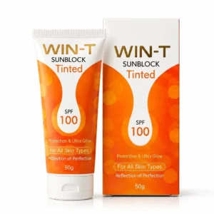 WIN-T tinted sunblock positioned beside its box on polished surface with warm lighting.